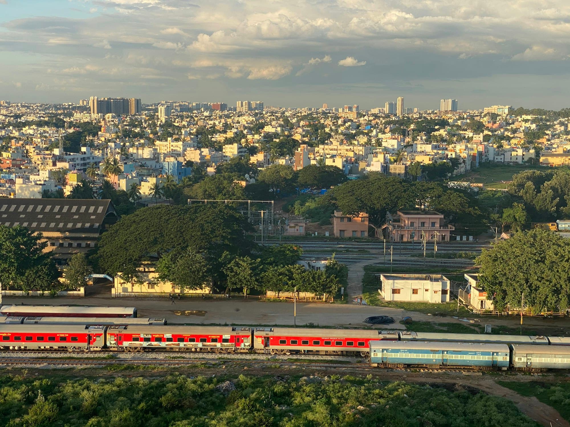 A metro train crossing Bengaluru in daylight