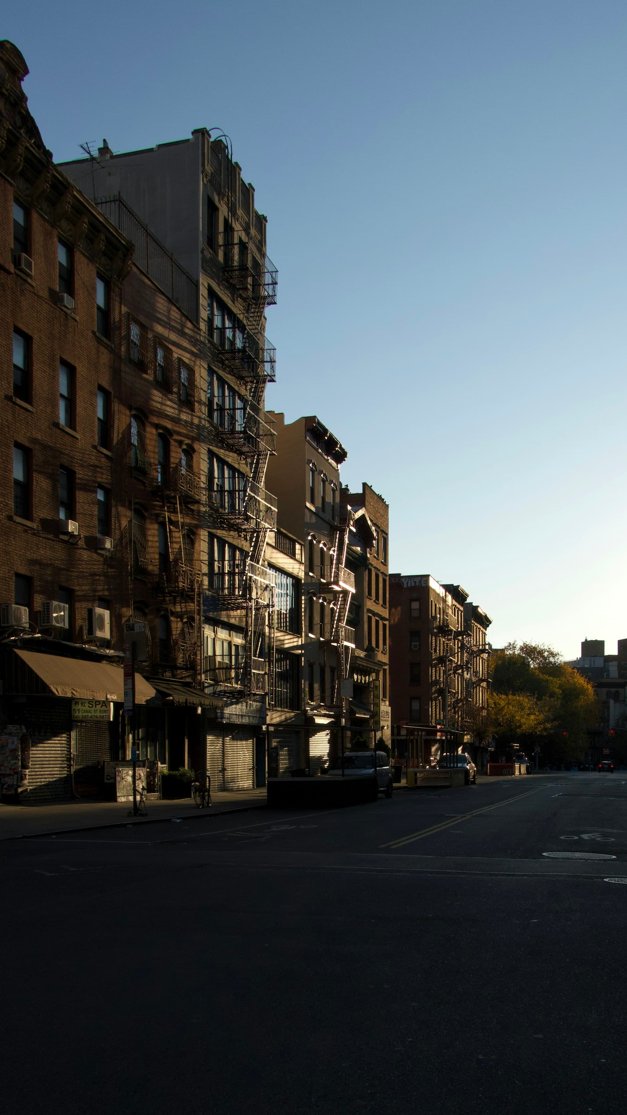Apartment buildings with fire escapes on a New York street